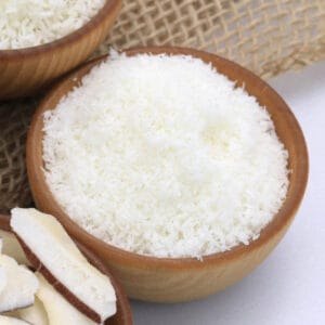 Bulk Coconut Desiccated in wooden bowl